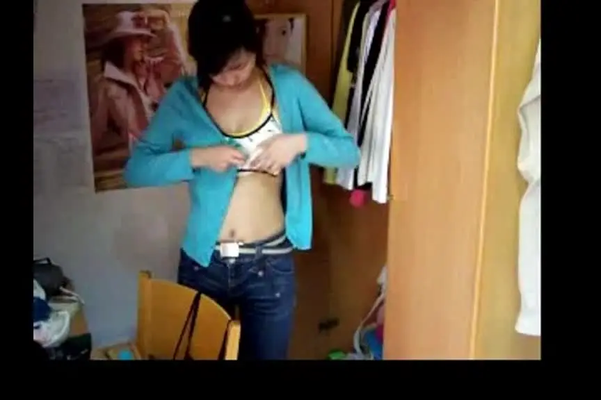 College girl tries on underwear and naughtily shows off her breasts, so cute